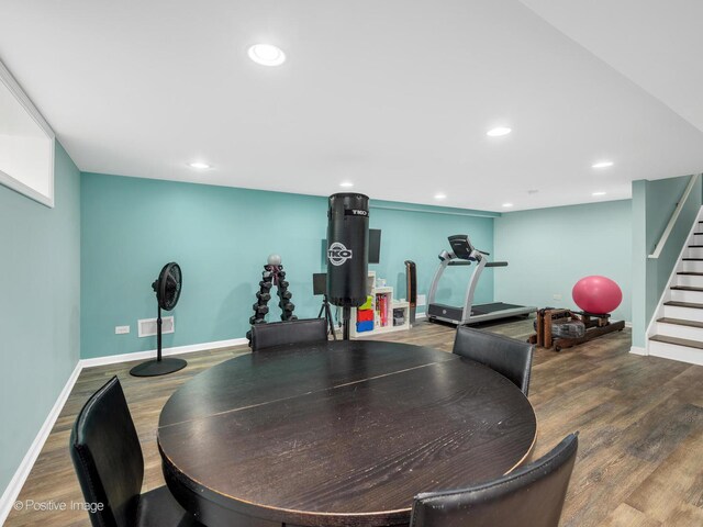 carpeted bedroom featuring baseboards and multiple windows