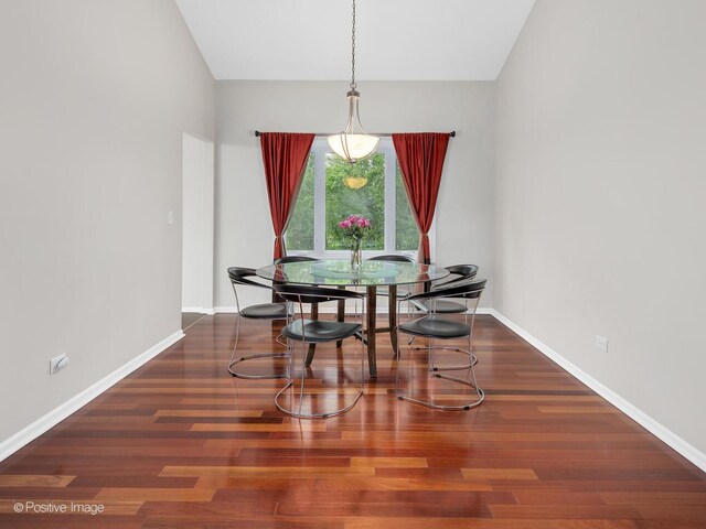 living area featuring lofted ceiling with beams, stairs, and hardwood / wood-style floors
