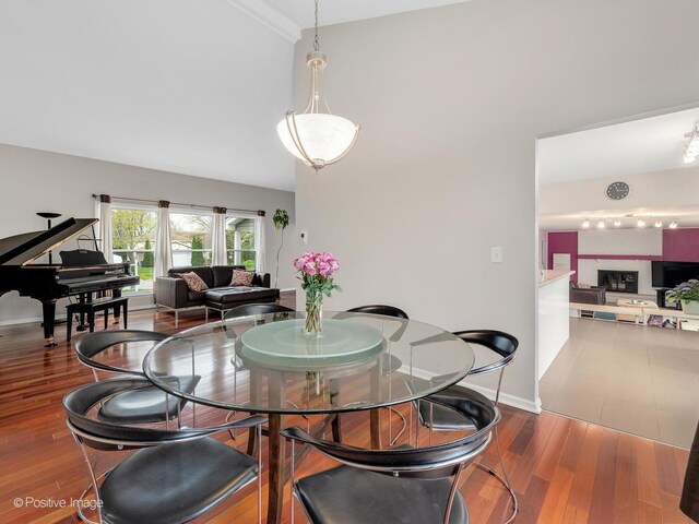 living area featuring baseboards and wood finished floors