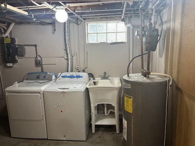 clothes washing area featuring separate washer and dryer, water heater, electric panel, and laundry area