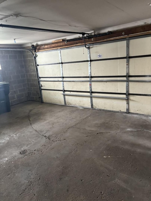 garage with concrete block wall