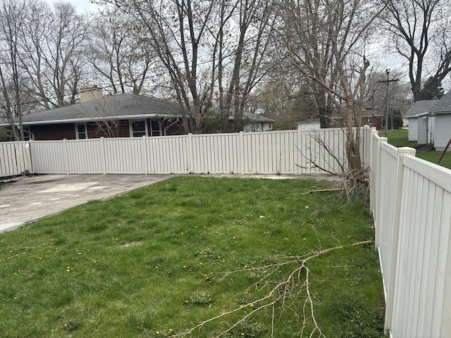 view of yard with a fenced backyard