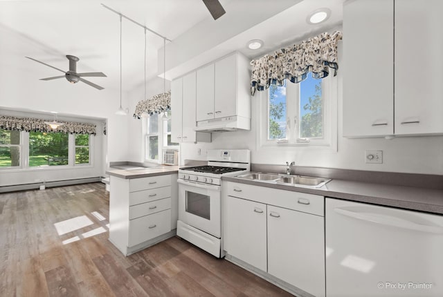 109 3rd Ave, Montgomery, IL 60538 - kitchen with white appliances, ceiling fan, baseboard heating, under cabinet range hood, and white cabinets