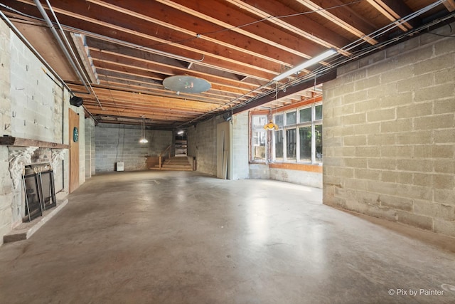 109 3rd Ave, Montgomery, IL 60538 - below grade area with stairs and a stone fireplace