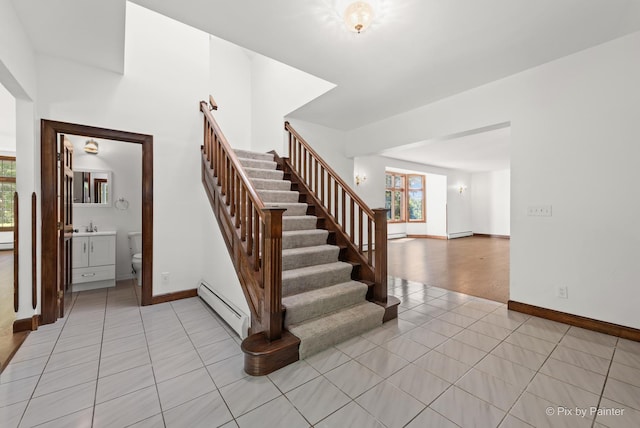 109 3rd Ave, Montgomery, IL 60538 - staircase with a baseboard radiator, tile patterned floors, and baseboard heating