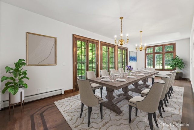 109 3rd Ave, Montgomery, IL 60538 - dining area featuring a chandelier and a baseboard heating unit