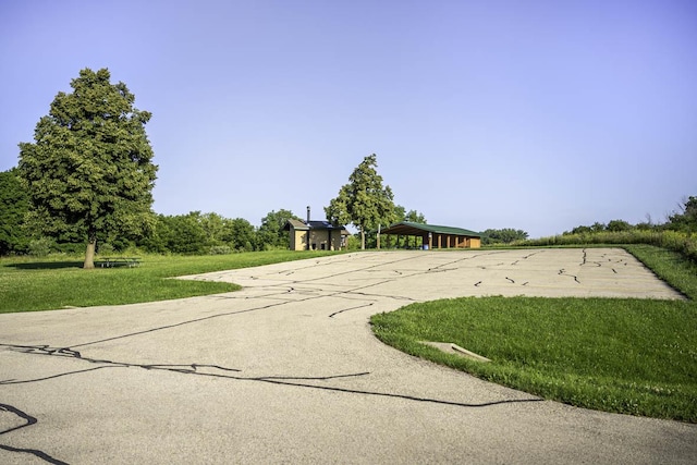 view of street with concrete driveway