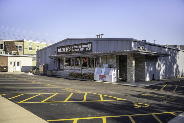 view of property featuring uncovered parking