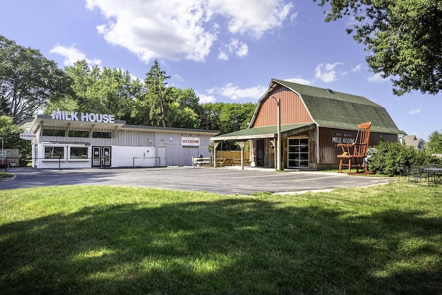 view of property featuring a barn