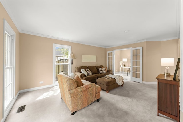 living area featuring baseboards, visible vents, light carpet, and french doors