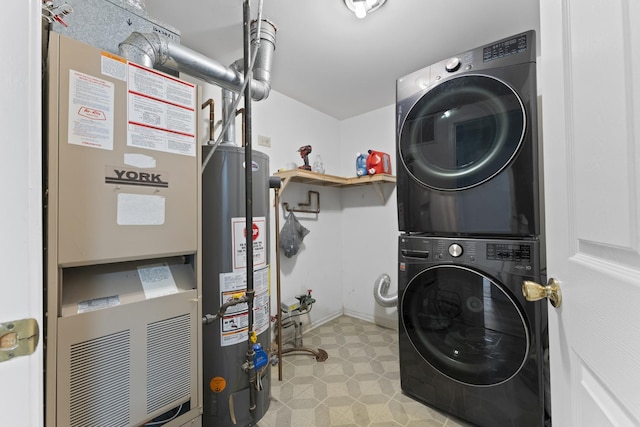 laundry area with laundry area, stacked washer and dryer, heating unit, baseboards, and gas water heater