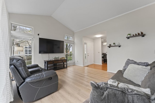 living room featuring light wood-style floors and vaulted ceiling
