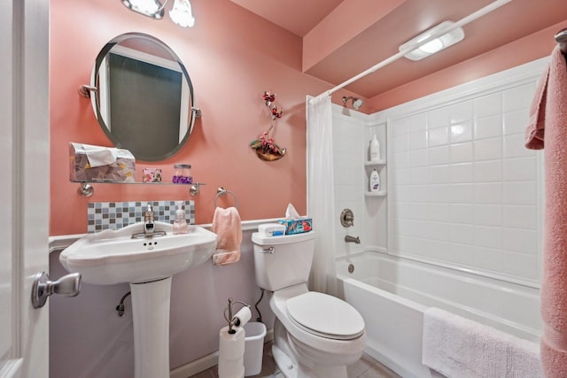 full bath with shower / tub combo and toilet