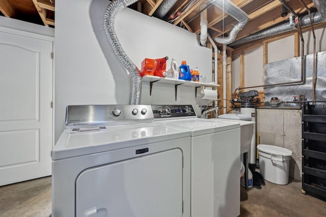 laundry room with separate washer and dryer and laundry area