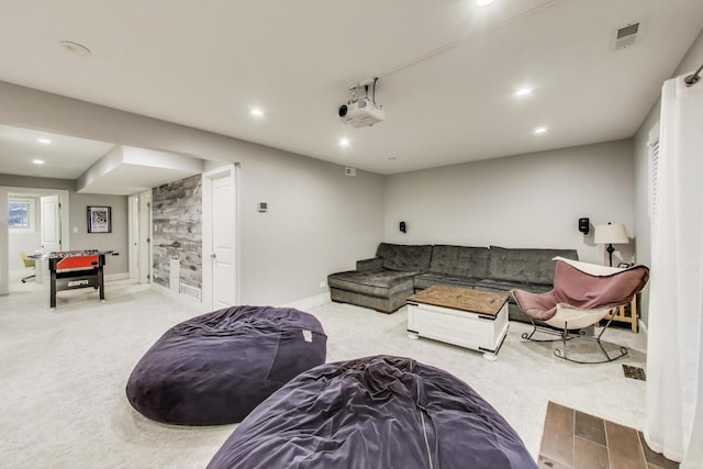 carpeted living room with recessed lighting and baseboards