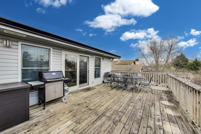 deck with outdoor dining area