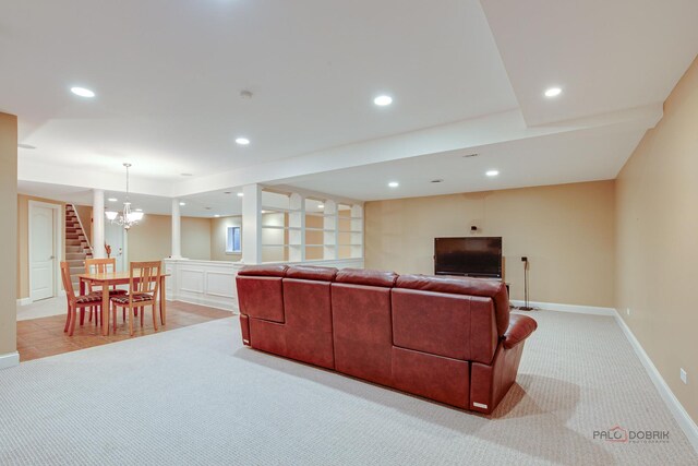 living area featuring recessed lighting, baseboards, an inviting chandelier, and light carpet