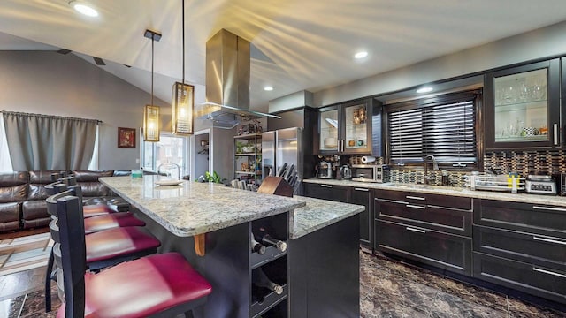 8129 45th Pl, Lyons, IL 60534 - kitchen featuring island exhaust hood, stainless steel fridge with ice dispenser, a breakfast bar, a sink, and open floor plan