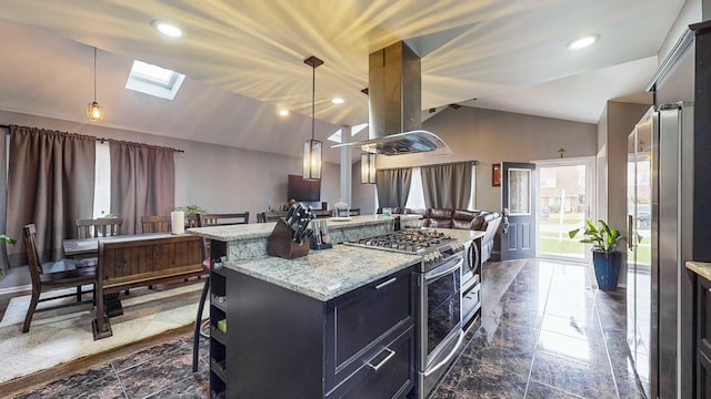 8129 45th Pl, Lyons, IL 60534 - kitchen with a center island, vaulted ceiling with skylight, island exhaust hood, stainless steel appliances, and dark cabinets