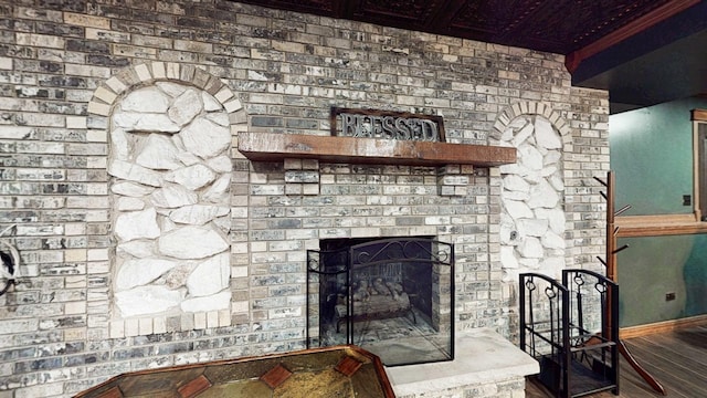 8129 45th Pl, Lyons, IL 60534 - room details featuring baseboards, wood finished floors, and a fireplace