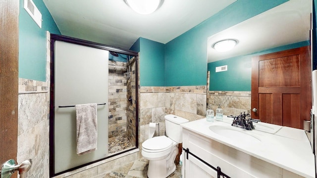 8129 45th Pl, Lyons, IL 60534 - full bath featuring a shower stall, vanity, tile walls, toilet, and visible vents