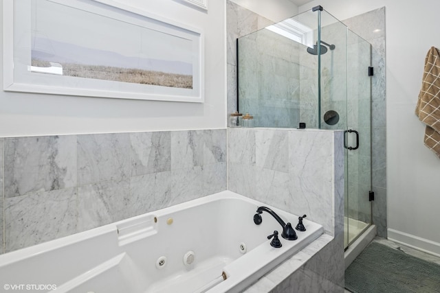 bathroom featuring a whirlpool tub and a stall shower