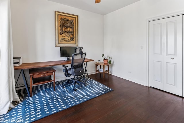 home office with baseboards, ceiling fan, and wood finished floors