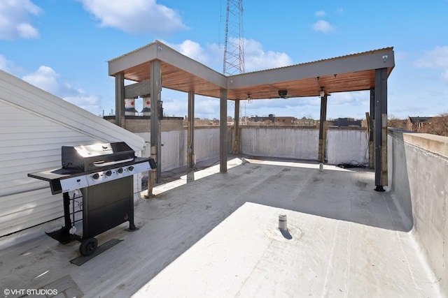 view of patio featuring a carport, fence, and area for grilling