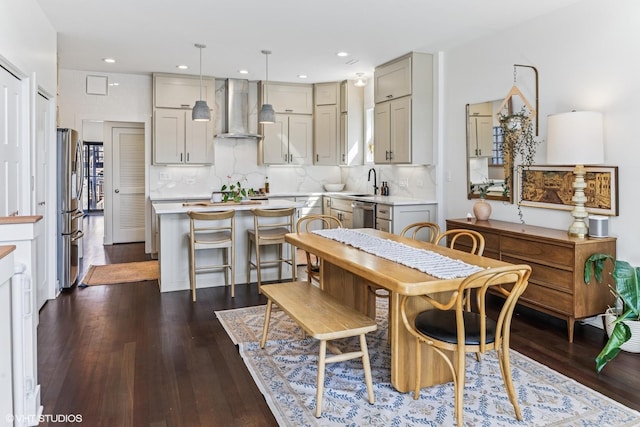 dining area with recessed lighting and dark wood finished floors