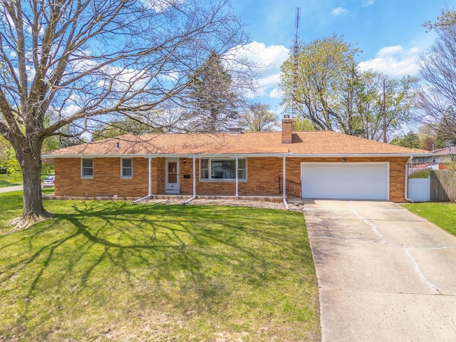 ranch-style home featuring concrete driveway, a chimney, an attached garage, fence, and a front lawn