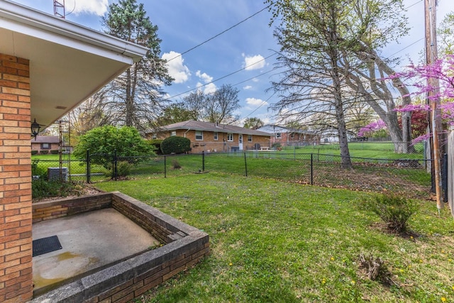 view of yard featuring a gate, fence private yard, central AC, and a patio area