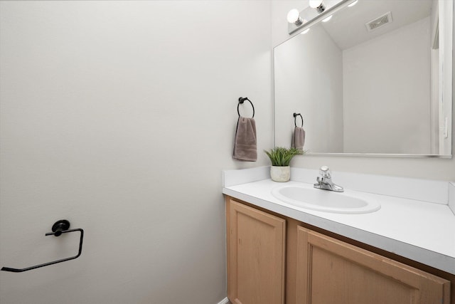 bathroom featuring vanity and visible vents