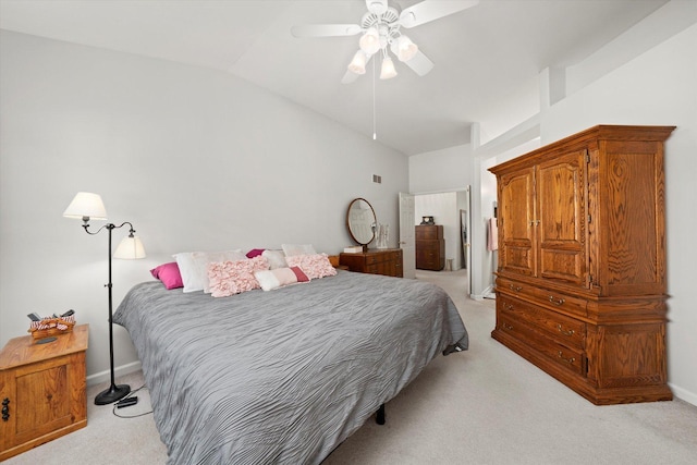 bedroom with lofted ceiling, light carpet, a ceiling fan, and baseboards