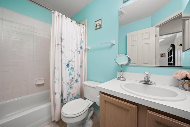 full bathroom with visible vents, shower / bath combo, vanity, and toilet