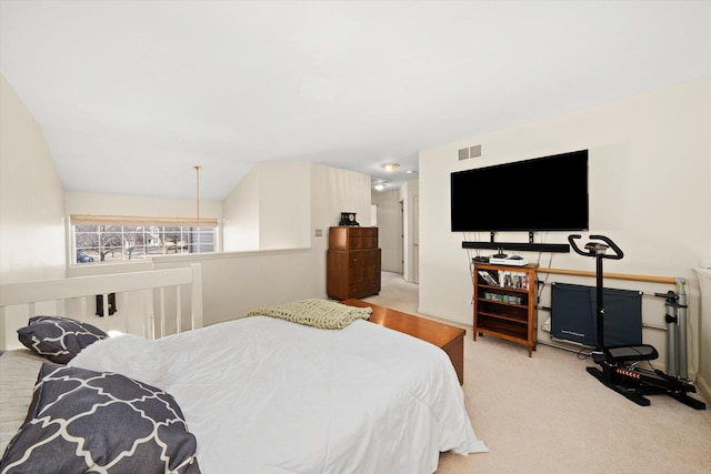 carpeted bedroom featuring visible vents