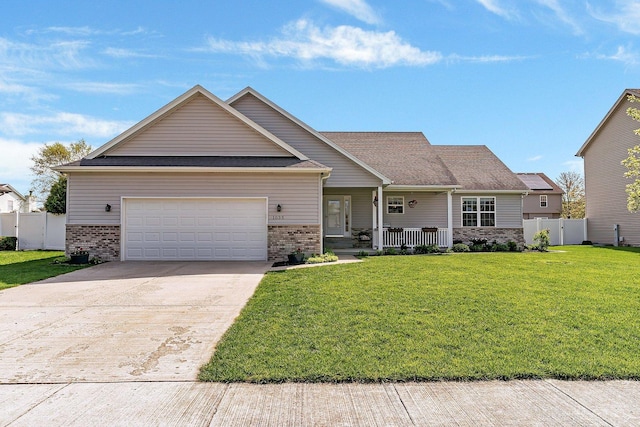 1035 Heritage Dr, Diamond, IL 60416 - view of front of home featuring fence, a front yard, a porch, and brick siding