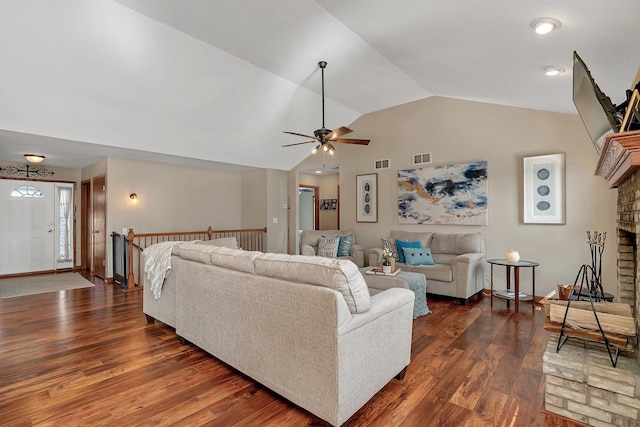 1035 Heritage Dr, Diamond, IL 60416 - living area with visible vents, a brick fireplace, a ceiling fan, dark wood-type flooring, and vaulted ceiling