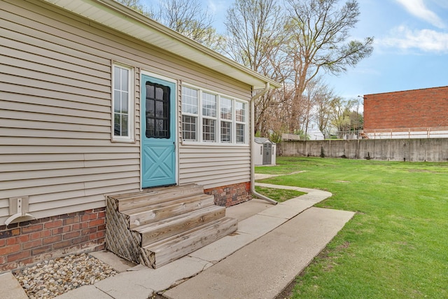 112 W 1st St, Streator, IL 61364 - view of exterior entry with fence and a lawn
