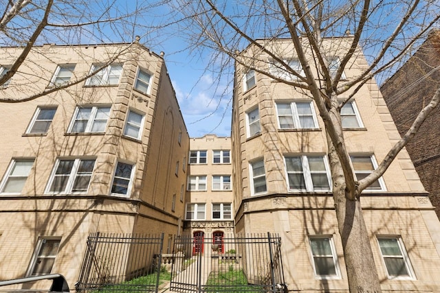 view of building exterior featuring a fenced front yard