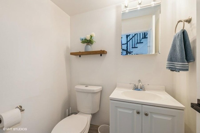 half bath with toilet and vanity