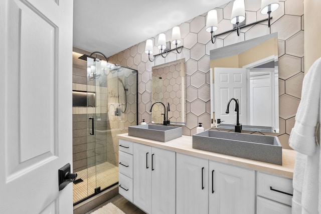 113 Welwyn St Unit 0, Lake Bluff, IL 60044 - bathroom featuring a stall shower and double vanity
