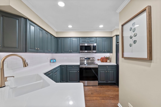 113 Welwyn St Unit 0, Lake Bluff, IL 60044 - kitchen with stainless steel appliances, ornamental molding, light countertops, dark wood finished floors, and tasteful backsplash