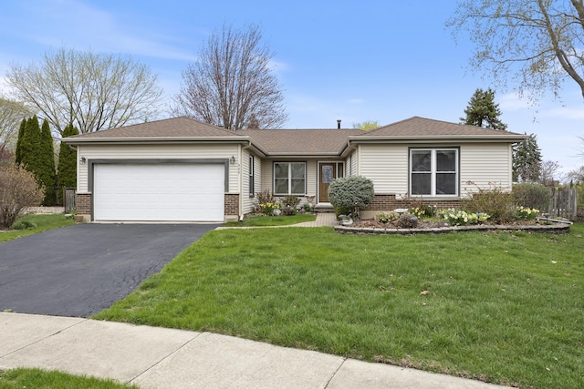 ranch-style home with brick siding, a front lawn, driveway, and a garage
