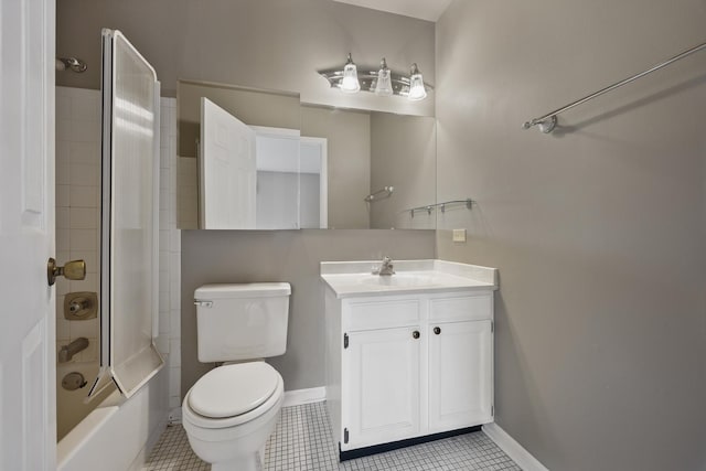 full bathroom with tile patterned floors, vanity, shower / tub combination, baseboards, and toilet