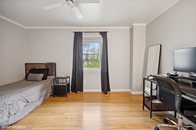 bedroom featuring baseboards, ornamental molding, a ceiling fan, and light wood finished floors