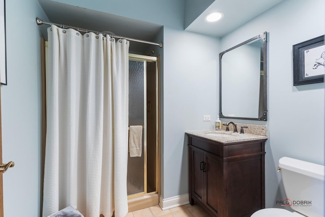 full bath with tile patterned floors, toilet, baseboards, a shower stall, and vanity