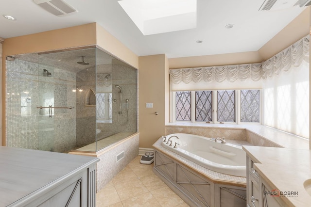 full bath with a garden tub, a skylight, a tile shower, tile patterned flooring, and visible vents