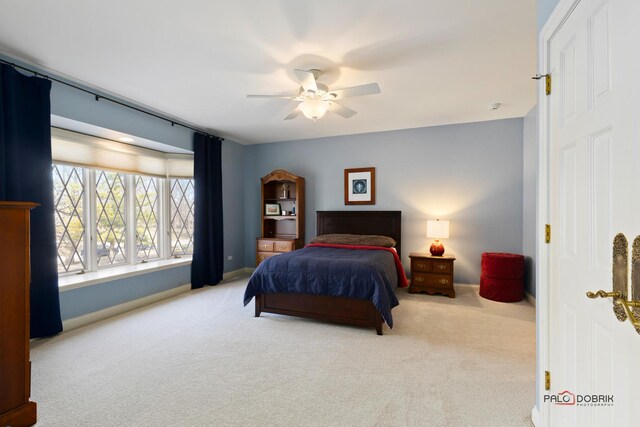 bedroom featuring carpet flooring, baseboards, and ceiling fan