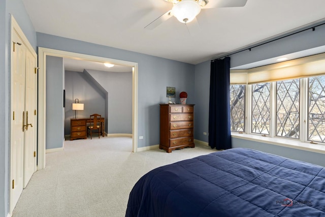 bedroom with carpet floors, a ceiling fan, and baseboards