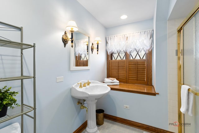 bathroom featuring baseboards and tile patterned floors
